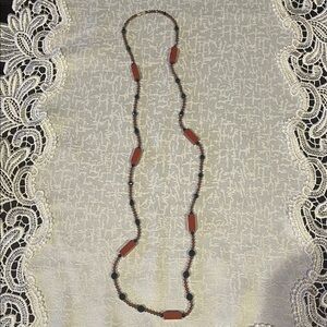 Long Beaded Necklace in Brick Red and Black Accents
